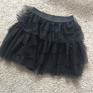 Black ruffled mini skirt